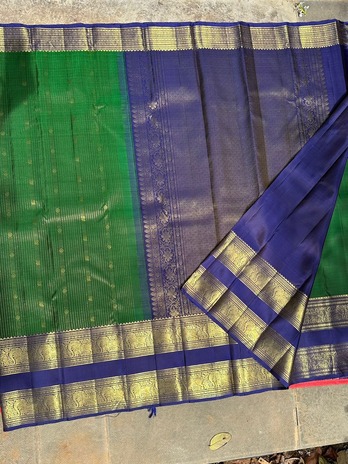 Pure Kanchipuram handloom silk saree in Peacock Green colour and navy blue border