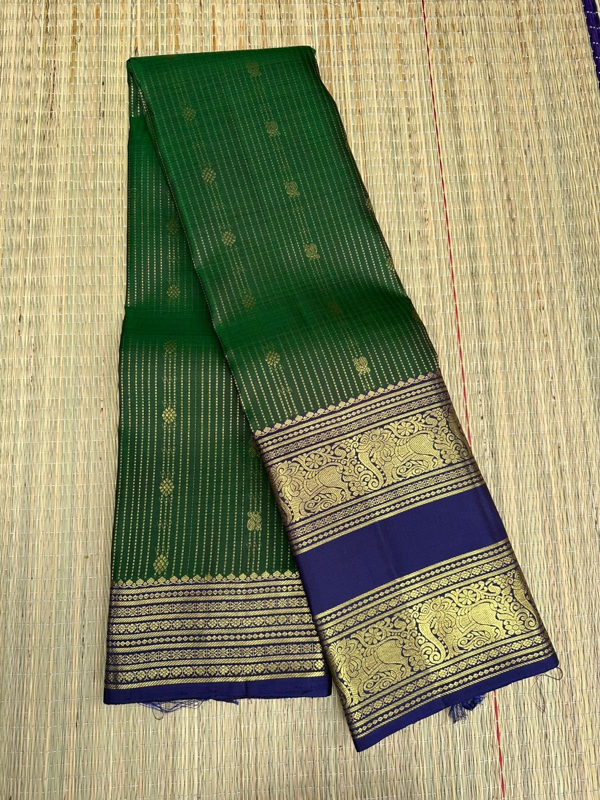 Pure Kanchipuram handloom silk saree in Peacock Green colour and navy blue border